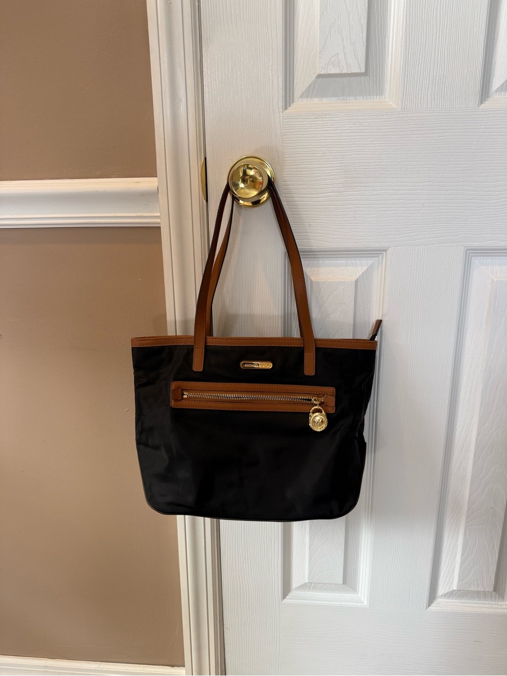 Michael Kors Black Tote with Brown Trim and Gold Accents